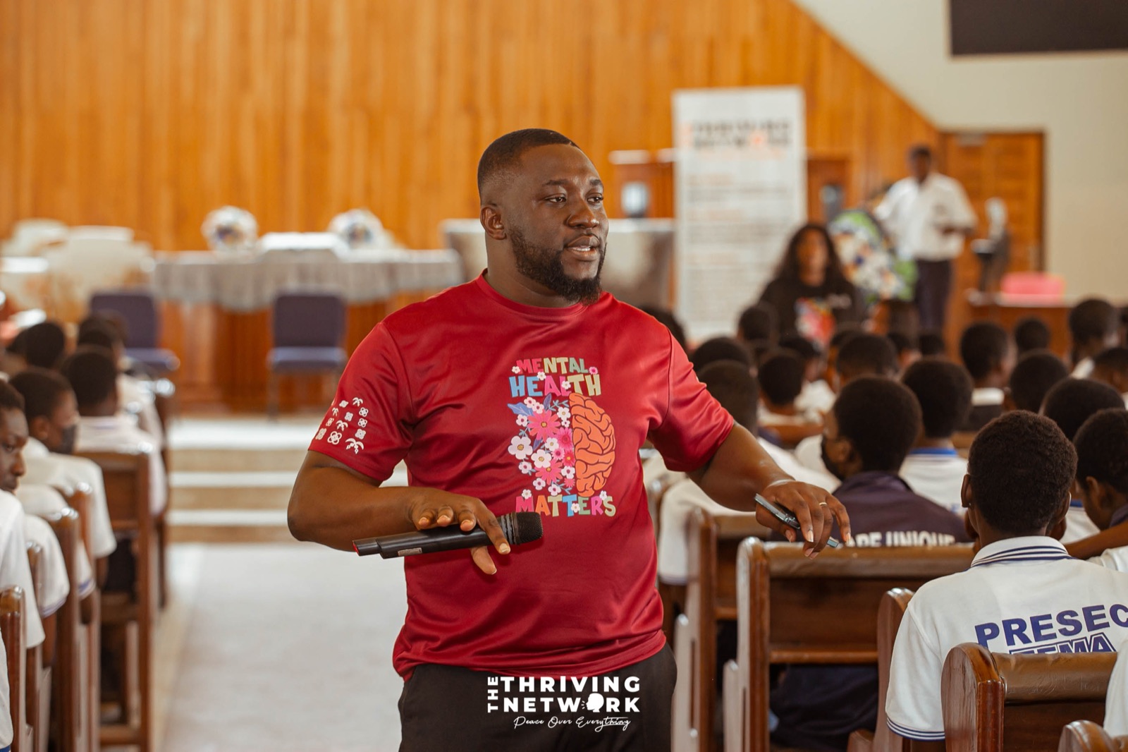 A speaker addressing students during a TTNGH mental health education programme