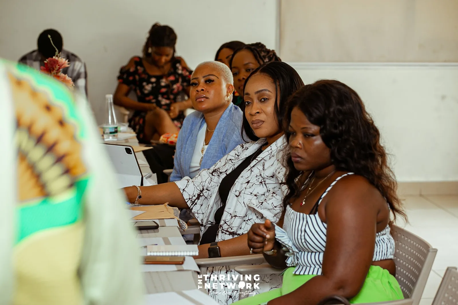 Participants listening together around a table